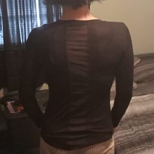 Cool black top with see through fabric.